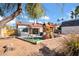Extensive backyard featuring a playground, hot tub, mature trees, and a custom built shed for extra storage at 1801 E Hearn Rd, Phoenix, AZ 85022