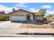 Charming home featuring a well-maintained front yard and a two-car garage at 1801 E Hearn Rd, Phoenix, AZ 85022