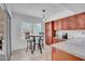 Kitchen area with stainless steel appliances, lots of wood cabinetry and a table with chairs at 1801 E Hearn Rd, Phoenix, AZ 85022