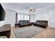 Bright living room featuring comfortable seating and a large area rug at 1801 E Hearn Rd, Phoenix, AZ 85022