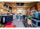Organized workshop interior with ample storage, workbenches, and an American flag at 1801 E Hearn Rd, Phoenix, AZ 85022