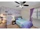 This bedroom has a ceiling fan and cute decor at 19828 N 35Th St, Phoenix, AZ 85050