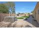 Beautiful backyard features a hot tub, pool, and gazebo, perfect for entertaining and relaxation at 2050 N 144Th Dr, Goodyear, AZ 85395