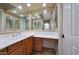 Bathroom featuring dual vanities, ample lighting, and tile floors at 2050 N 144Th Dr, Goodyear, AZ 85395