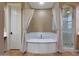 Bathroom showcasing a tub, vanity, and tile floors at 2050 N 144Th Dr, Goodyear, AZ 85395
