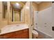 Cozy bathroom with a single vanity sink, toilet, and a shower-tub combo at 2050 N 144Th Dr, Goodyear, AZ 85395