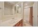 Bathroom with a large mirror, a sink, and a shower tub at 2050 N 144Th Dr, Goodyear, AZ 85395