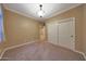 Bedroom featuring neutral walls, carpet flooring, and large closet at 2050 N 144Th Dr, Goodyear, AZ 85395