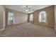 Spacious bedroom featuring large windows, neutral paint, and ample natural light at 2050 N 144Th Dr, Goodyear, AZ 85395