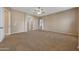 Open bedroom showcasing neutral walls, carpet, and an adjoining space at 2050 N 144Th Dr, Goodyear, AZ 85395