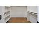 Walk-in closet featuring carpeted floors and built-in shelving at 2050 N 144Th Dr, Goodyear, AZ 85395