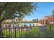 Inviting community pool area with lounge chairs, umbrellas, and a relaxing atmosphere at 2050 N 144Th Dr, Goodyear, AZ 85395