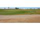 Immaculate golf course fairway with a concrete cart path alongside lush green grass at 2050 N 144Th Dr, Goodyear, AZ 85395