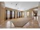 Spacious living room with tile and carpet flooring and large windows at 2050 N 144Th Dr, Goodyear, AZ 85395