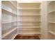 Pantry shelves providing storage for groceries and kitchen essentials at 2050 N 144Th Dr, Goodyear, AZ 85395