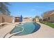 Backyard pool features an umbrella, gazebo, and lush green artificial turf and patio areas at 2050 N 144Th Dr, Goodyear, AZ 85395