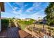 A balcony featuring views of lush green landscaping and neighborhood street at 21041 N 61St Dr, Glendale, AZ 85308