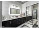 This updated bathroom features modern cabinets, fixtures, and tile work at 21041 N 61St Dr, Glendale, AZ 85308