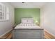 This bright bedroom has a bed, side table, window, and great natural light at 21041 N 61St Dr, Glendale, AZ 85308