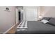This bedroom features hardwood floors, neutral paint, and a large closet at 21041 N 61St Dr, Glendale, AZ 85308