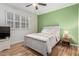 Bedroom with a cozy bed, side table, and a window, offering a relaxing retreat at 21041 N 61St Dr, Glendale, AZ 85308