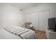 Bedroom featuring laminate floors, a chair, and a TV, perfect for relaxation at 21041 N 61St Dr, Glendale, AZ 85308