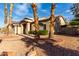 Single story home with desert landscaping, a tile roof, and a three car garage at 21041 N 61St Dr, Glendale, AZ 85308