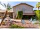 Spacious two-story home featuring a fountain and lush desert landscaping at 21041 N 61St Dr, Glendale, AZ 85308