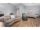 This home features an open floorplan with a spacious living room and hardwood flooring at 21041 N 61St Dr, Glendale, AZ 85308