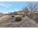 View of a gravel-covered backyard with low-maintenance landscaping at 21613 N Sunset Dr, Maricopa, AZ 85139
