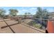 Backyard view from the upstairs deck, showcasing a well-maintained outdoor space at 21613 N Sunset Dr, Maricopa, AZ 85139