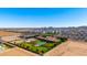 Extensive property with a pool, lawn, and desert landscape in the background at 21962 E Diana Way, Queen Creek, AZ 85142