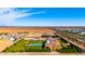 Wide-angle shot of estate featuring pool, yard, and surrounding desert landscape at 21962 E Diana Way, Queen Creek, AZ 85142