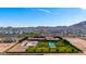 Sprawling property with a pool, large lawn, and desert surroundings at 21962 E Diana Way, Queen Creek, AZ 85142