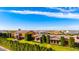 Stunning aerial view of a luxurious estate with manicured lawns, mature trees, and a grand architectural design at 21962 E Diana Way, Queen Creek, AZ 85142
