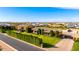 Gorgeous aerial perspective of an estate showcasing lush landscaping, a well-maintained lawn, and an inviting circular driveway at 21962 E Diana Way, Queen Creek, AZ 85142
