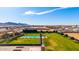 Spacious backyard with a refreshing pool, manicured lawns, and beautiful views creating a private retreat at 21962 E Diana Way, Queen Creek, AZ 85142