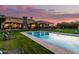 Beautiful backyard with a large pool, manicured lawn, and elegant estate, perfect for outdoor enjoyment at 21962 E Diana Way, Queen Creek, AZ 85142