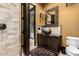 Stylish powder room with vessel sink, granite countertop, and decorative mirror at 21962 E Diana Way, Queen Creek, AZ 85142