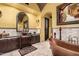 Elegant bathroom with a freestanding copper tub and decorative brick arch at 21962 E Diana Way, Queen Creek, AZ 85142