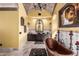 Luxurious bathroom featuring a copper tub, stone floors, and ornate chandeliers at 21962 E Diana Way, Queen Creek, AZ 85142