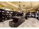 Large walk-in closet with custom shelving and an island dresser at 21962 E Diana Way, Queen Creek, AZ 85142