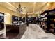 Luxury walk-in closet with custom shelving, lighting, and a central island at 21962 E Diana Way, Queen Creek, AZ 85142
