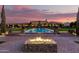 Elegant estate with outdoor firepit overlooking the large pool, offering a luxurious lifestyle with scenic views at 21962 E Diana Way, Queen Creek, AZ 85142