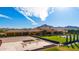 Sprawling estate with a lush lawn, a pool, and mountain views at 21962 E Diana Way, Queen Creek, AZ 85142