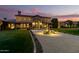 A beautiful front entrance featuring manicured landscaping and a fountain at 21962 E Diana Way, Queen Creek, AZ 85142