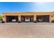 Exterior view of a three-car garage showcasing luxury SUVs parked on a paved driveway at 21962 E Diana Way, Queen Creek, AZ 85142