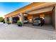Spacious three-car garage with open doors showcasing luxury SUVs and ample storage space at 21962 E Diana Way, Queen Creek, AZ 85142