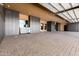 Expansive garage featuring custom storage solutions and durable paver flooring for a stylish and functional area at 21962 E Diana Way, Queen Creek, AZ 85142