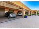 Spacious three-car garage with luxury SUVs, storage cabinets and lantern style lighting at 21962 E Diana Way, Queen Creek, AZ 85142